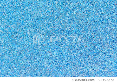 Close-up of rubber soft coating texture. Surface used on sport stadium, running track, treadmill, children's playground. 92592878