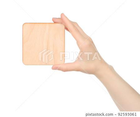 Hand holds blank wooden plaque on white background 92593061