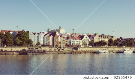 Szczecin waterfront with clear blue sky at dawn, retro color toning applied, Poland. Szczecin waterfront with clear blue sky at dawn, retro color toning applied, Poland. 92595479