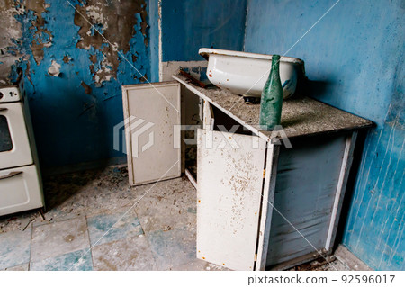 Kitchen of abandoned apartment in the ghost town Pripyat in Chernobyl Exclusion Zone, Ukraine 92596017
