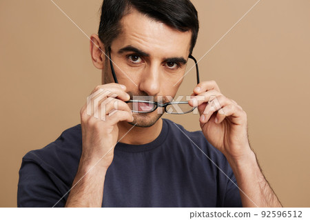 man glasses posing fashion self-confidence beige background man glasses posing fashion self-confidence beige background 92596512