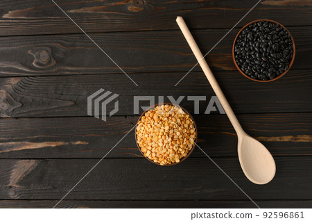 Fresh organic natural beans and peas on wooden rustic black background Fresh organic natural beans and peas on wooden rustic black background 92596861