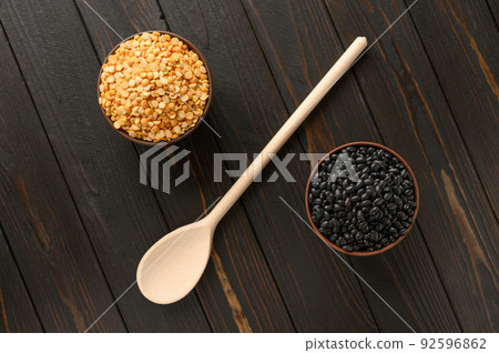 Fresh organic natural beans and peas on wooden rustic black background Fresh organic natural beans and peas on wooden rustic black background 92596862