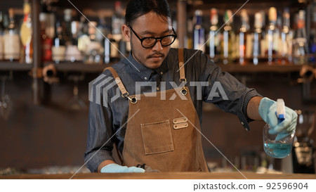 Night club concept of 4k Resolution. Asian staff cleaning the restaurant before getting ready to open. A group of specialized clubs that sell alcoholic beverages. Night club concept of 4k Resolution. Asian staff cleaning the restaurant before getting ready to open. A group of specialized clubs that sell alcoholic beverages. 92596904
