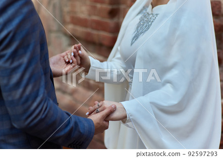 Bride and groom Asian Muslims marry in a beautiful red love theme. celebration nikah day. Bride and groom Asian Muslims marry in a beautiful red love theme. celebration nikah day. 92597293