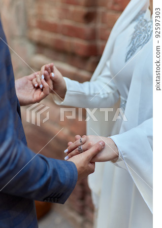 Bride and groom Asian Muslims marry in a beautiful red love theme. celebration nikah day. Bride and groom Asian Muslims marry in a beautiful red love theme. celebration nikah day. 92597303