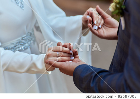 Bride and groom Asian Muslims marry in a beautiful red love theme. celebration nikah day. Bride and groom Asian Muslims marry in a beautiful red love theme. celebration nikah day. 92597305
