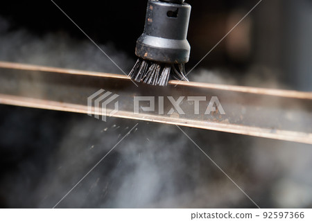 Experienced worker in rubber gloves steam-cleaning kitchen equipment. Experienced worker in rubber gloves steam-cleaning kitchen equipment. 92597366
