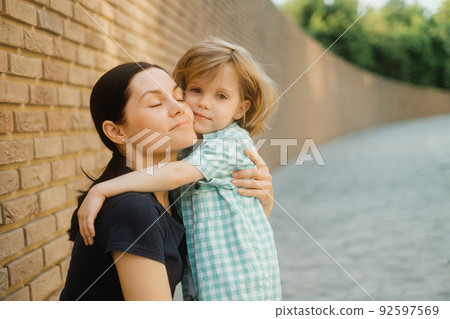 Closeup portrait of young mother and little son Closeup portrait of young mother and little son 92597569