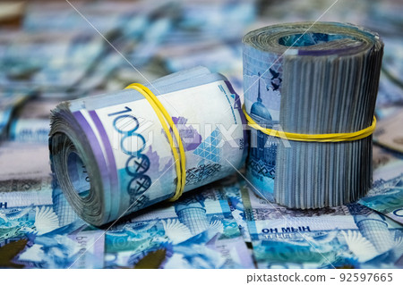 Thick wad of money cash on table. High quality photo Thick wad of money cash on table. High quality photo 92597665