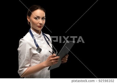 Portrait of an attractive young female doctor in white coat Portrait of an attractive young female doctor in white coat 92598102