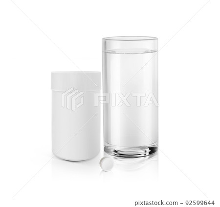 Complete prescription set up showing a glass of water, a white blank plastic medicine bottle and one white pill. 3d render 92599644