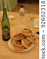 Bread and beer after a meal 92602318
