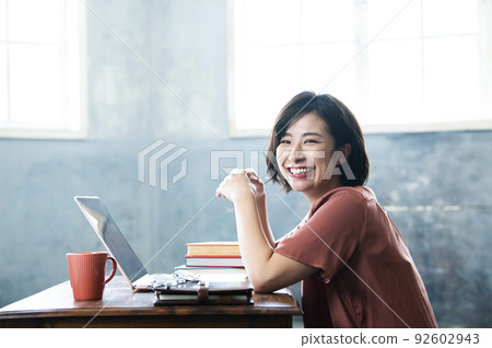 Female telework remote work smile looking at the camera Female telework remote work smile looking at the camera 92602943