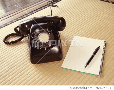 Black phone and notepad Black phone and notepad 92603405