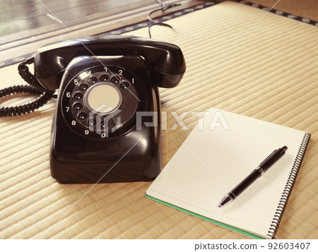 Black phone and notepad 92603407