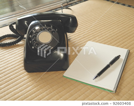 Black phone and notepad Black phone and notepad 92603408