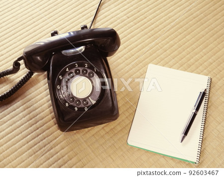 Black phone and notepad 92603467