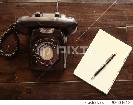 Black phone and notepad 92603640