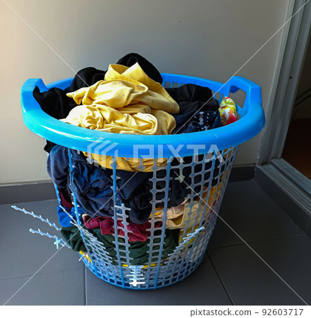 Broken blue plastic laundry basket. Broken blue plastic laundry basket. 92603717