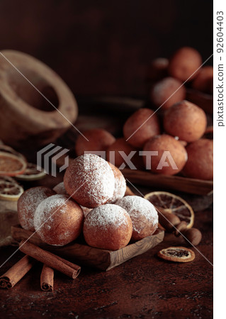 Cottage cheese doughnuts sprinkled with sugar powder. Cottage cheese doughnuts sprinkled with sugar powder. 92604403