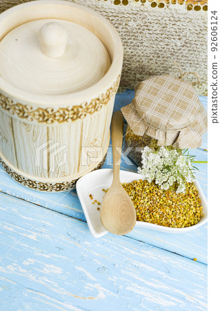 Wooden barrel with honey and other bee products, wax, bee pollen Wooden barrel with honey and other bee products, wax, bee pollen 92606124