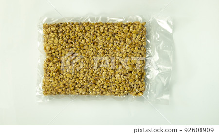 pine nuts packed in a bag on a white background, isolated 92608909