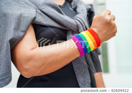 Asian woman with rainbow flag, LGBT symbol rights and gender equality, LGBT Pride Month in June. 92609422