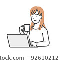 Woman relaxing in front of a laptop 92610212