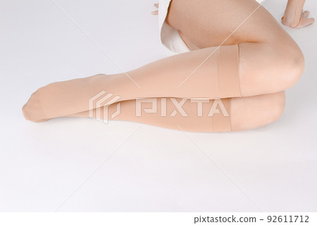Medical Compression Stockings for varicose veins and venouse therapy. Compression Hosiery. Sock for sports isolated on white background. Black color socks mock up for advertising, branding, design. 92611712