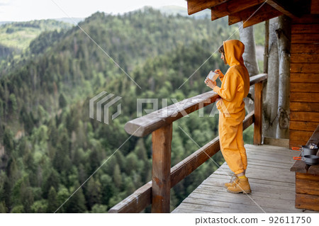 Woman enjoys great view on mountains at nature house 92611750