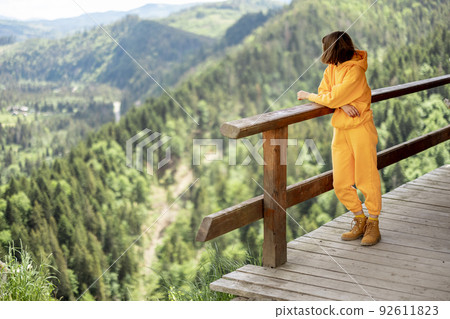 Person enjoys great mountain landscape 92611823