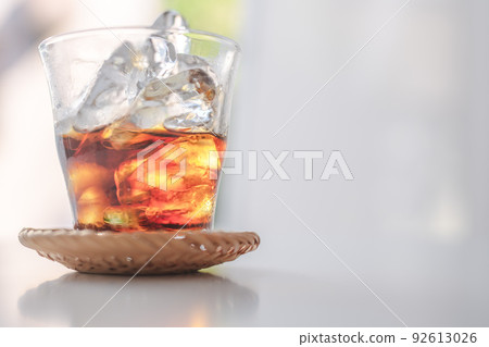 Iced coffee by the bright window Iced coffee by the bright window 92613026