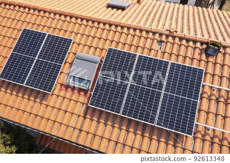 Solar panels on a roof. 92613348