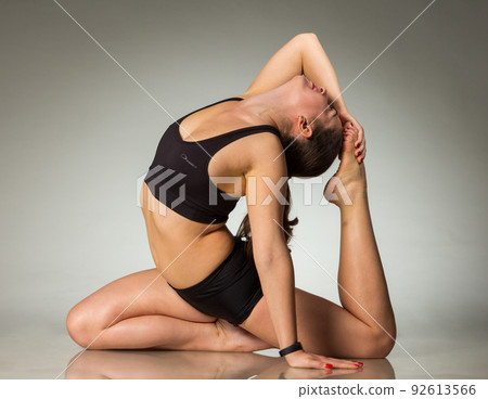 Fitness woman working out on the floor isolated on a white background 92613566