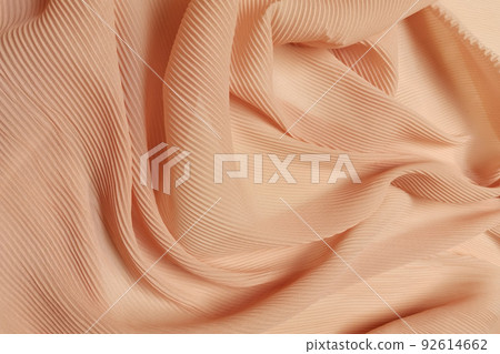 Orange chiffon fabric crumpled or wavy fabric texture background. Abstract linen cloth soft waves. Silk yarn. Smooth elegant luxury cloth texture. Concept for banner or advertisement. Orange chiffon fabric crumpled or wavy fabric texture background. Abstract linen cloth soft waves. Silk yarn. Smooth elegant luxury cloth texture. Concept for banner or advertisement. 92614662