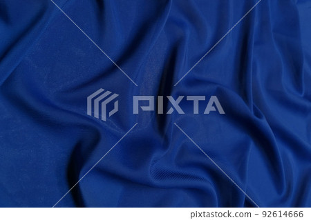 Blue chiffon fabric crumpled or wavy fabric texture background. Abstract linen cloth soft waves. Silk yarn. Smooth elegant luxury cloth texture. Concept for banner or advertisement. 92614666