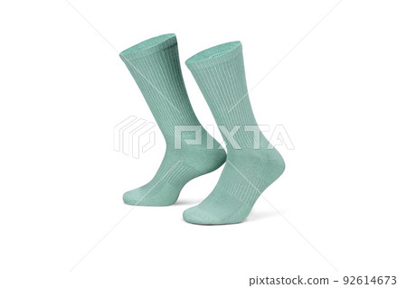 Pair of green cotton socks isolated on white. Set of short socks for sports as mock up and label for advertising, logo, branding. Pair of green cotton socks isolated on white. Set of short socks for sports as mock up and label for advertising, logo, branding. 92614673