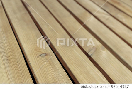 Wooden floor made of rough uncolored larch boards, background photo with perspective effect 92614917