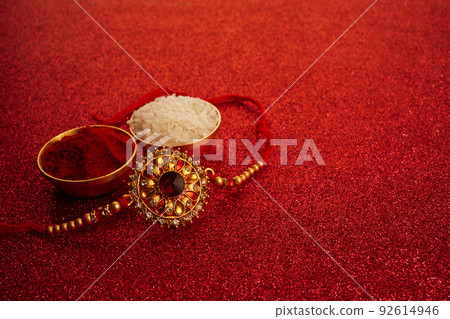 Indian festival Raksha Bandhan with wrist band Rakhi, Rice Grains and Kumkum. Indian festival Raksha Bandhan with wrist band Rakhi, Rice Grains and Kumkum. 92614946
