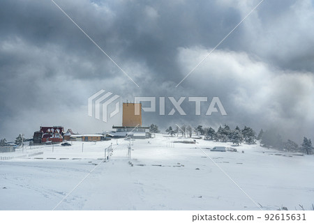 Snow covered forest and upper station on top of mountain Ai-Petri after blizzard. Crimea Snow covered forest and upper station on top of mountain Ai-Petri after blizzard. Crimea 92615631