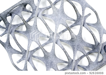 Model printed on 3D printer isolated on white background. Object details printed on 3D printer from plastic close-up. Prototype of shape made by 3d printer. Concept new modern printing technology 92616008