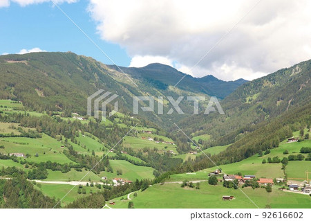 Mountain valley countyside Plain landscape of European countryside Mountain valley countyside Plain landscape of European countryside 92616602