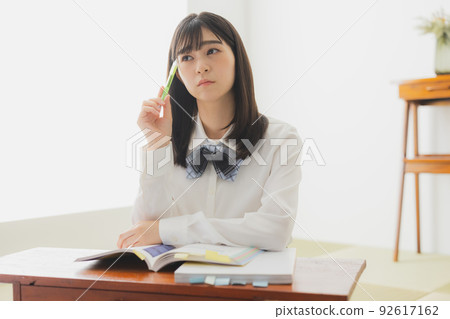 High school girl studying living room 92617162