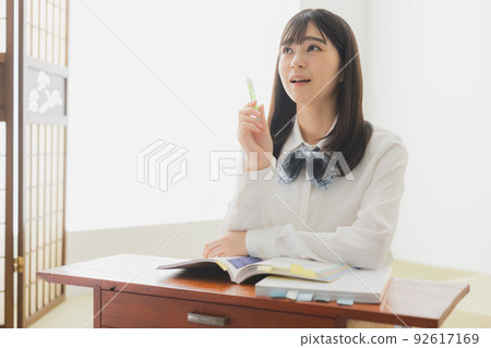 High school girl studying living room High school girl studying living room 92617169