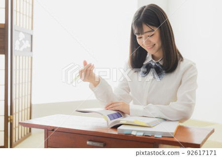 High school girl studying living room 92617171