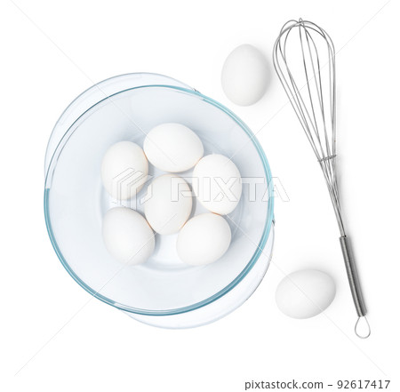 Fresh eggs with whisk isolated on white background Fresh eggs with whisk isolated on white background 92617417