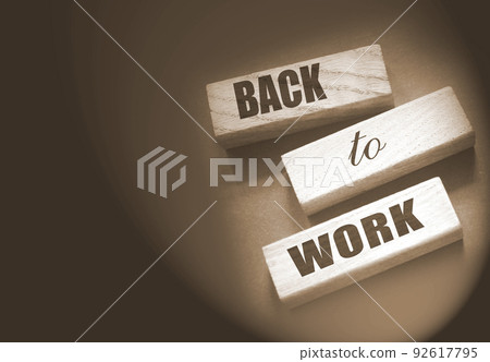Coronavirus concept showing wooden blocks on a dark grey background reading Back To Work Coronavirus concept showing wooden blocks on a dark grey background reading Back To Work 92617795