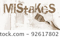 MISTAKES with paintbrush in woman hand. Business decisions mistake concept 92617802