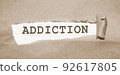 Addiction word under Brown torn paper . Stop smoking quit drinking refuce gaming and gambling concept 92617805